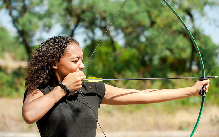 women holding bow and arrow